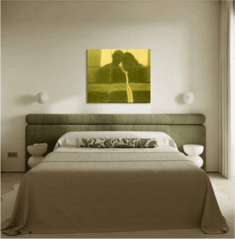 The bedroom with the artwork hanging above the bed